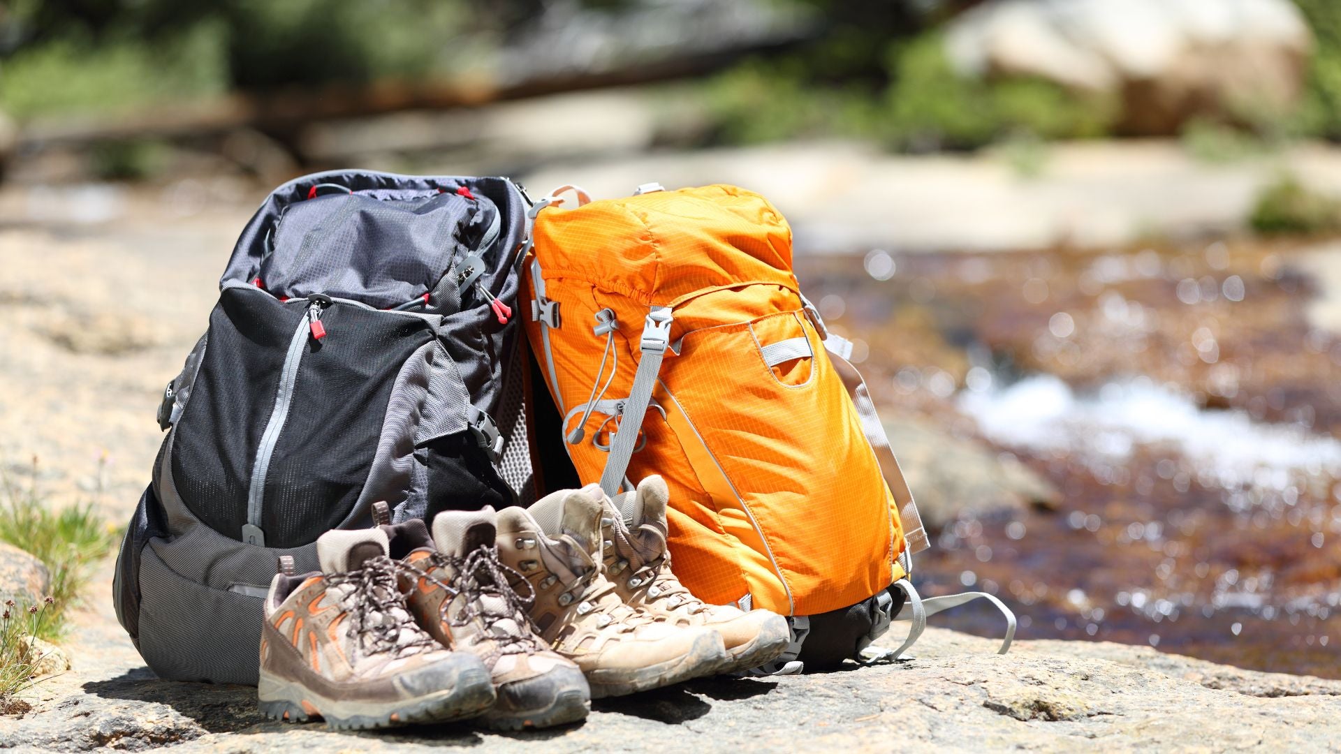 Two hiking backpacks and hiking boots