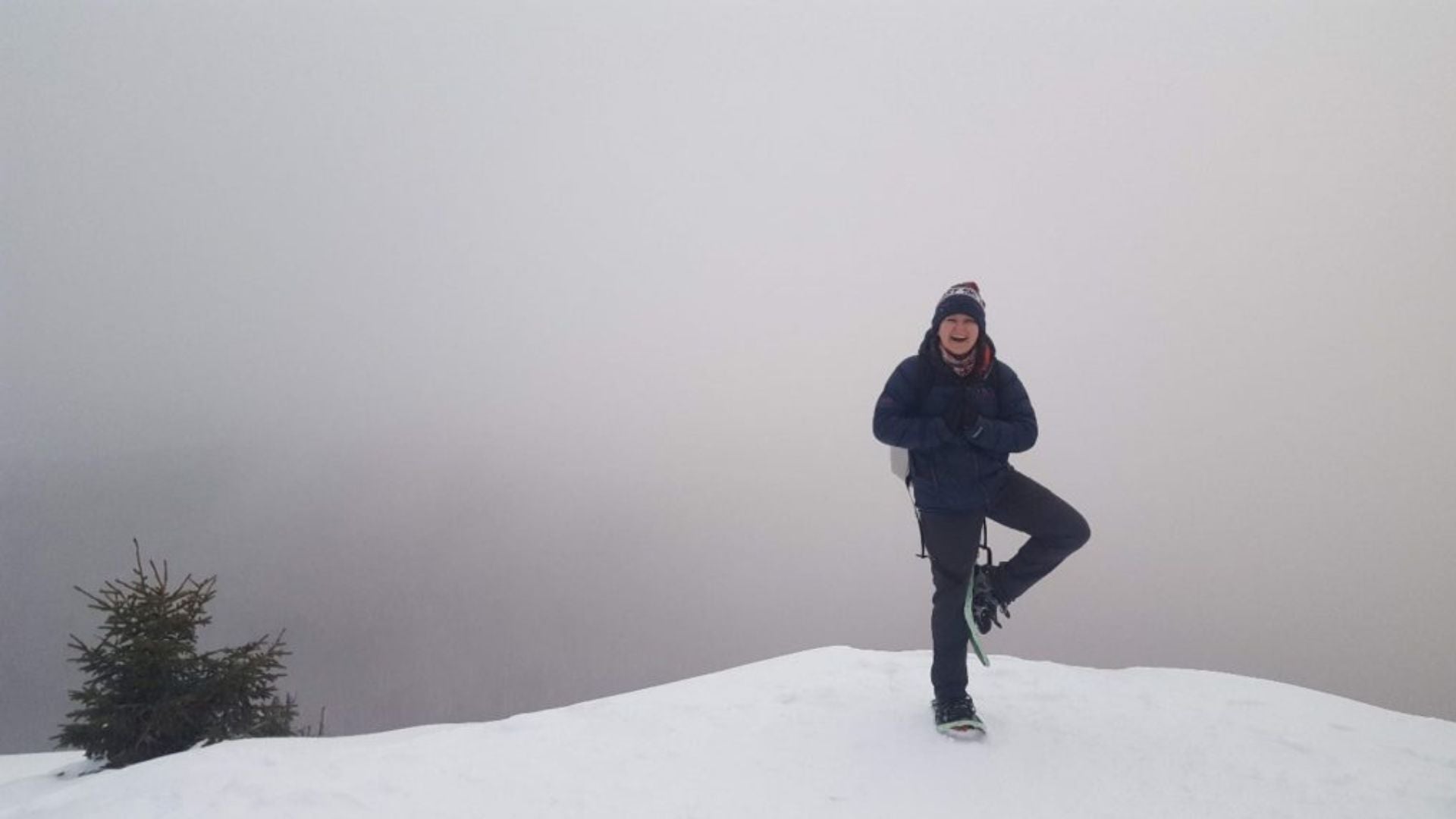 Woman doing yoga while hiking