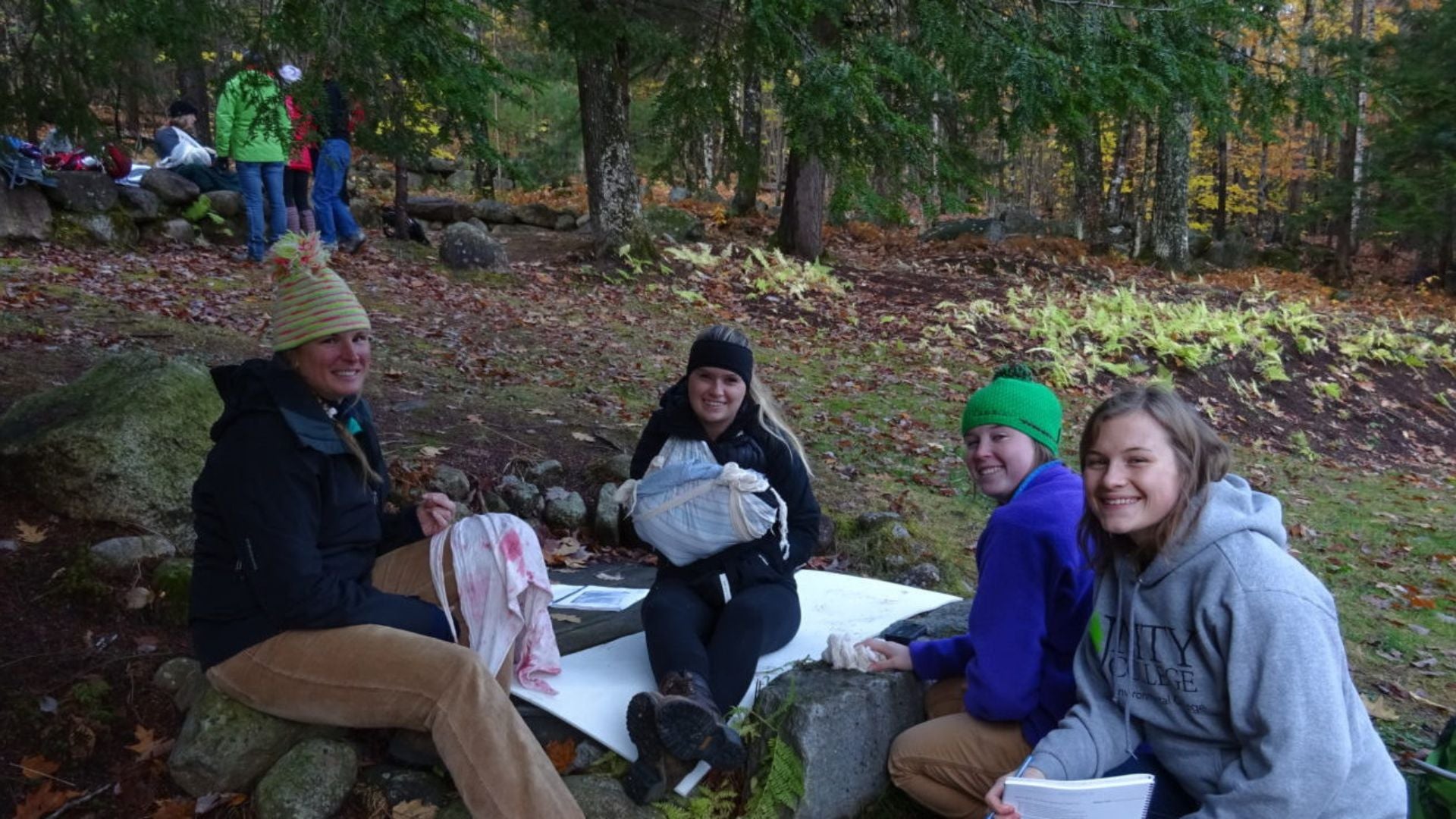 Girls on the ground learning wilderness skills