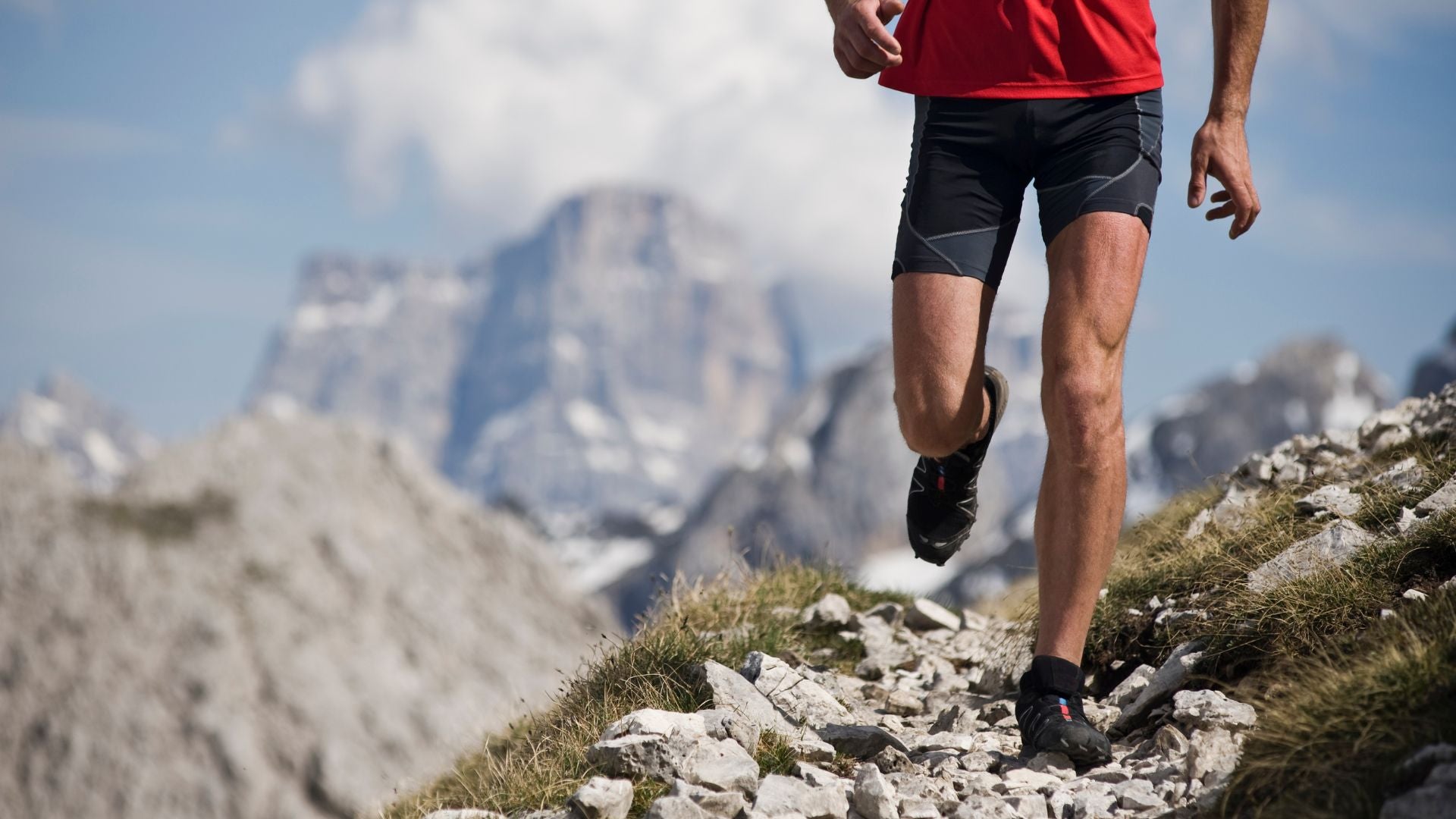 Person trail running at high altitude