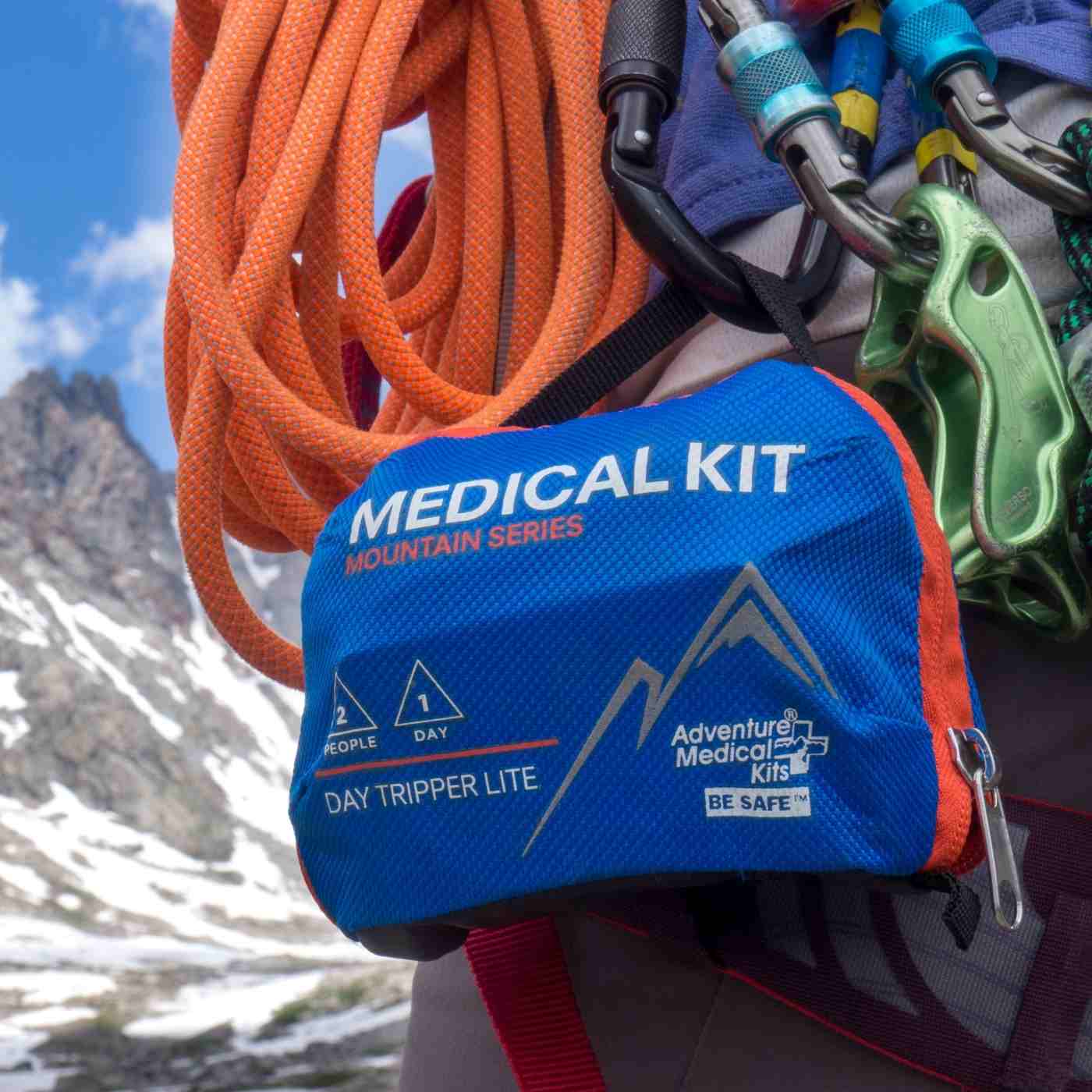 Mountain Series Medical Kit - Day Tripper Lite kit on climbers gear in front of mountains