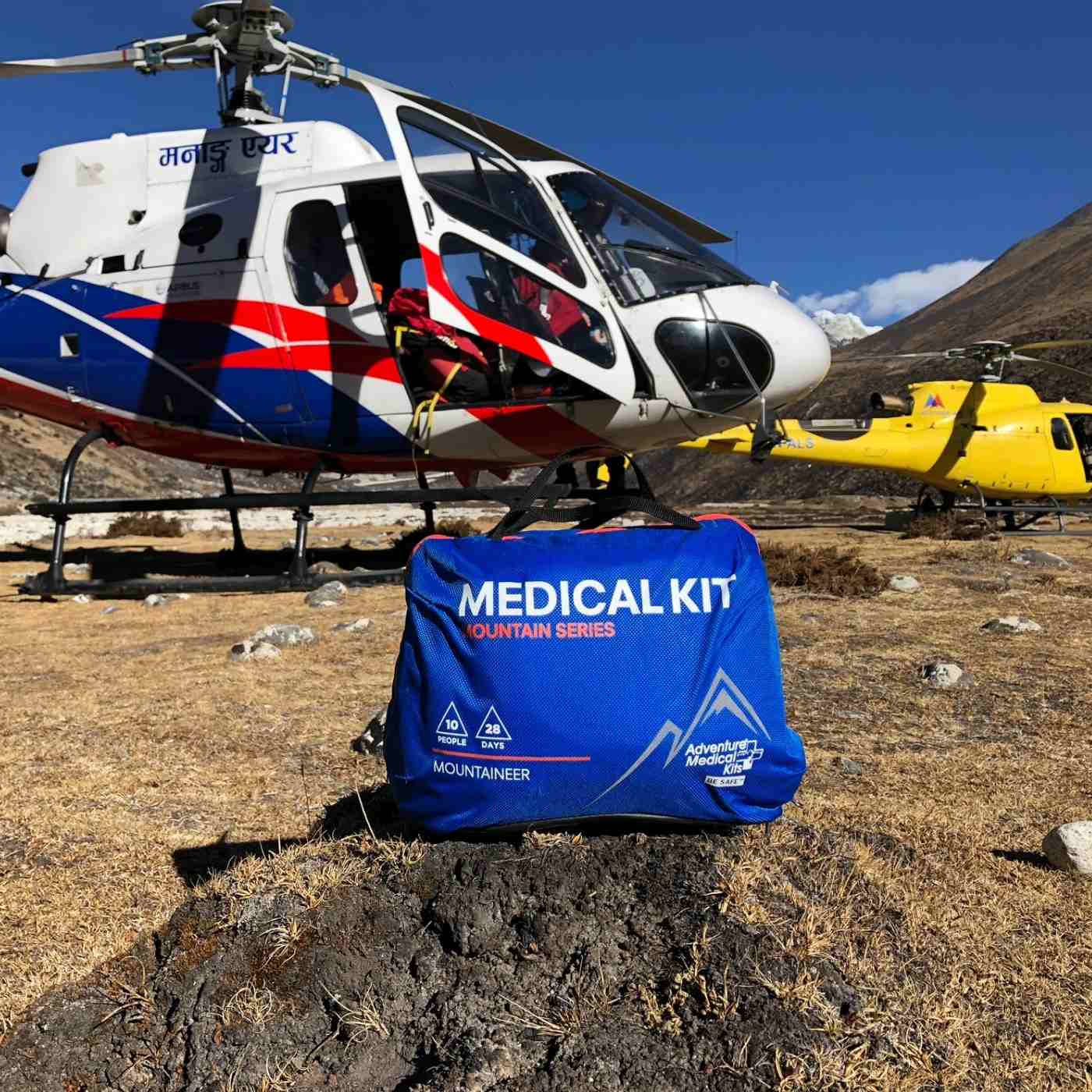 Mountain Series Medical Kit - Mountaineer kit posed in front of helicopter
