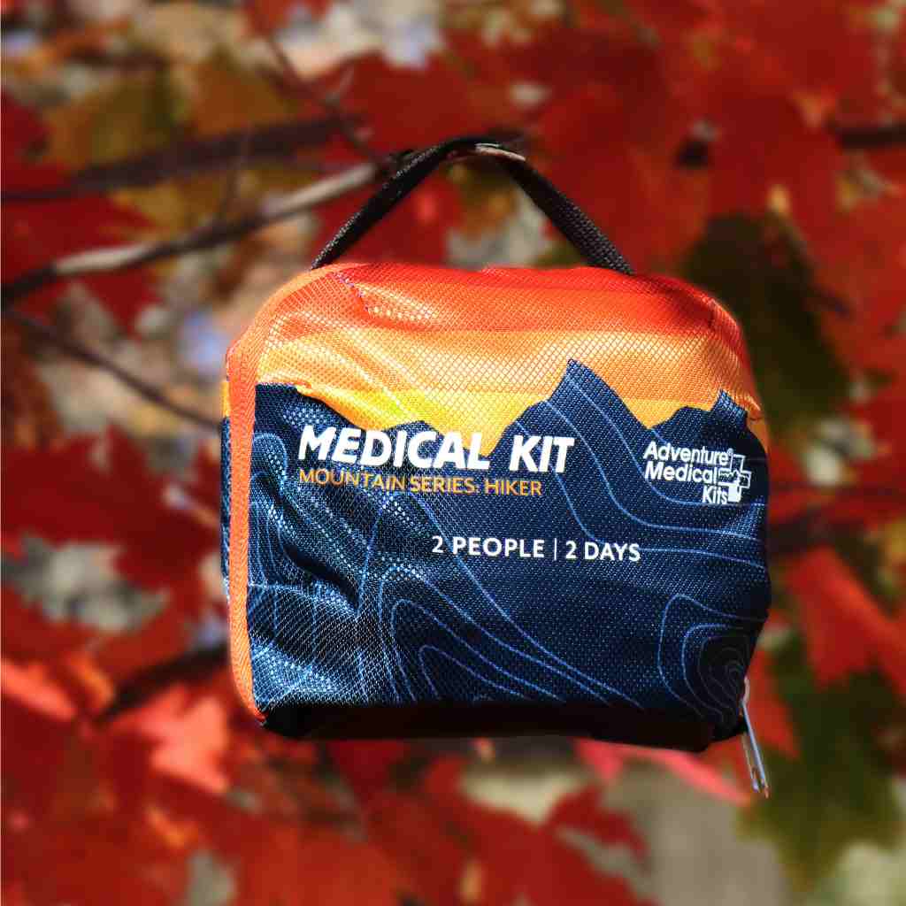 Mountain Series Hiker Sunset Kit hanging on tree with fall leaves