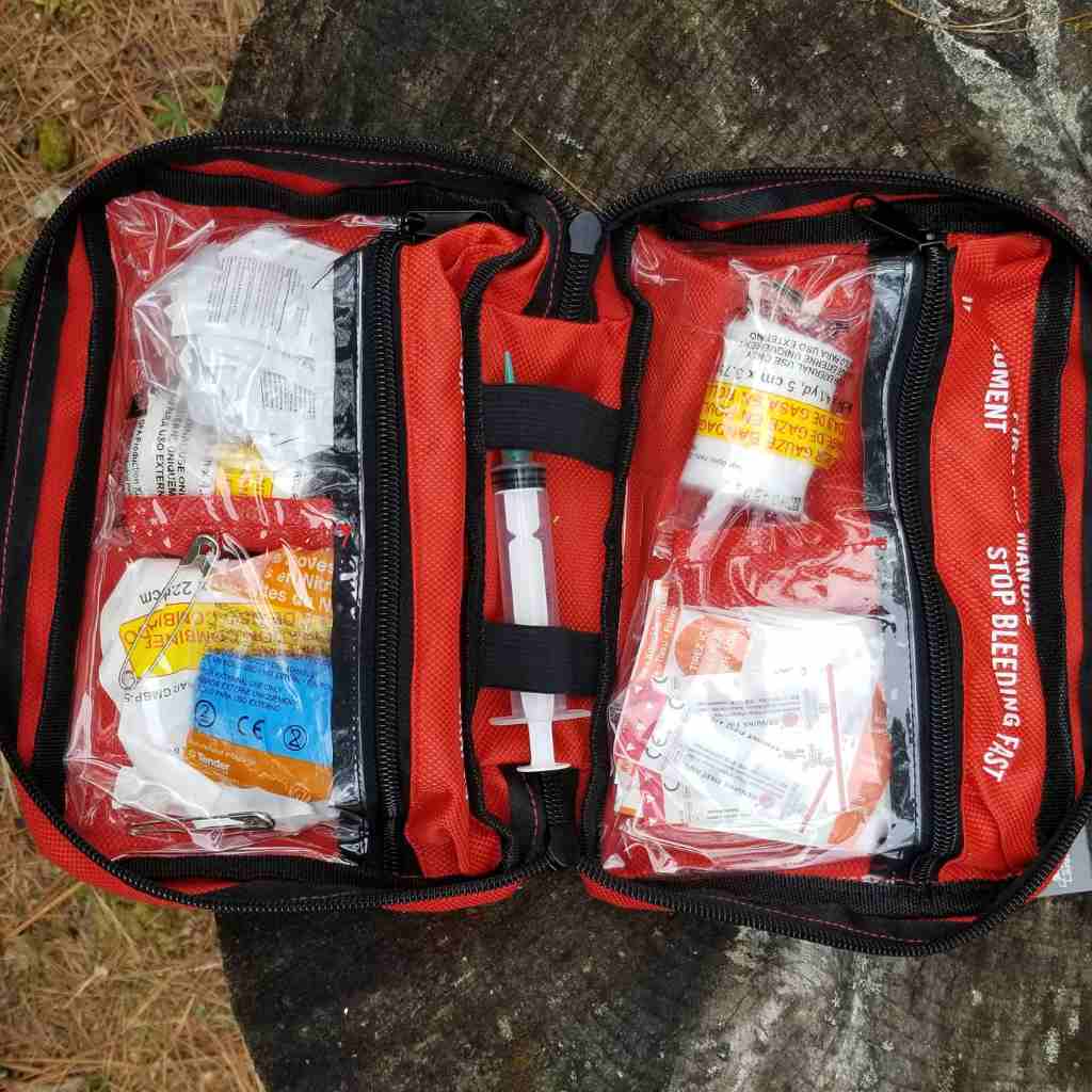 Sportsman Series Medical Kit - 200 kit opened on stump