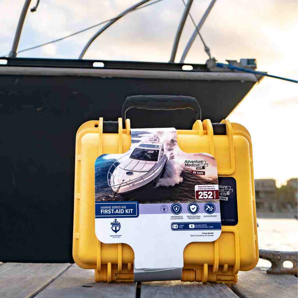Marine Series Medical Kit - 600 sitting in front of boat