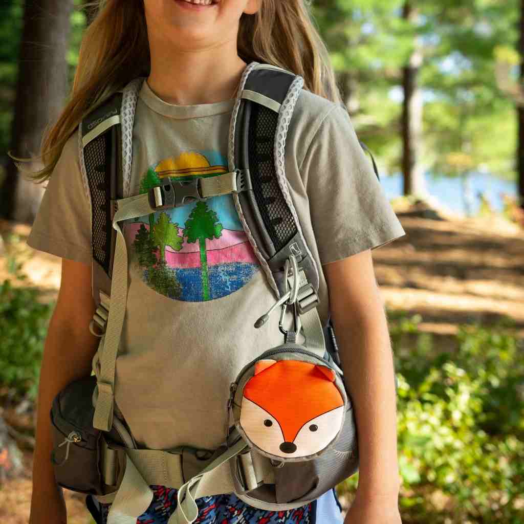 Backyard Adventure Fox First Aid Kit attached to child's backpack strap