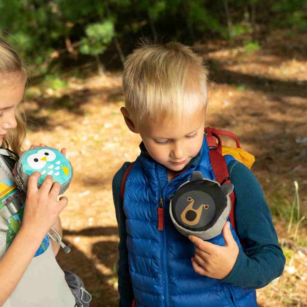 Backyard Adventure Bear First Aid Kit child looking at kit attached to backpack