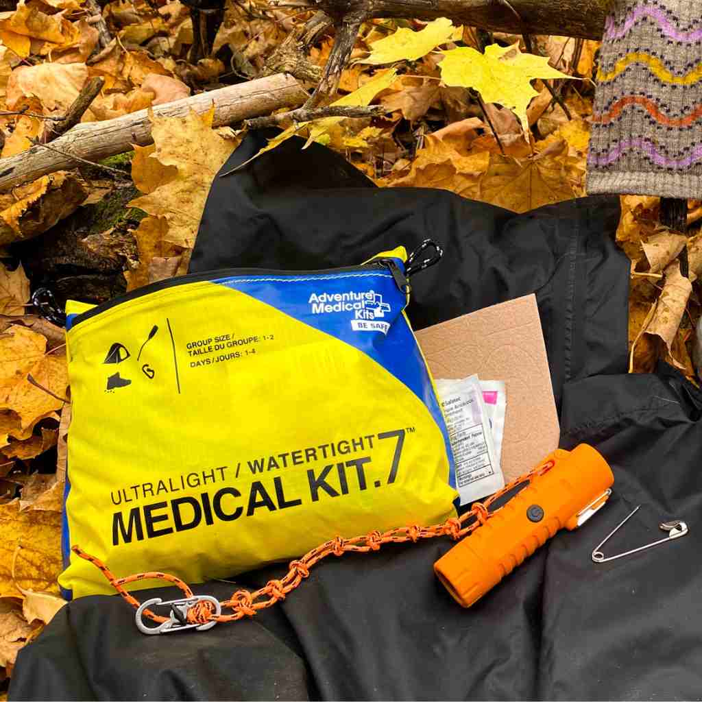 Ultralight/Watertight Medical Kit - .7 on jacket on leaves