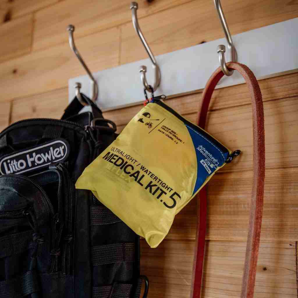 Ultralight/Watertight Medical Kit - .5 hanging from hook next to backpack