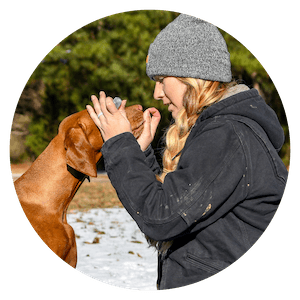 woman treating dog