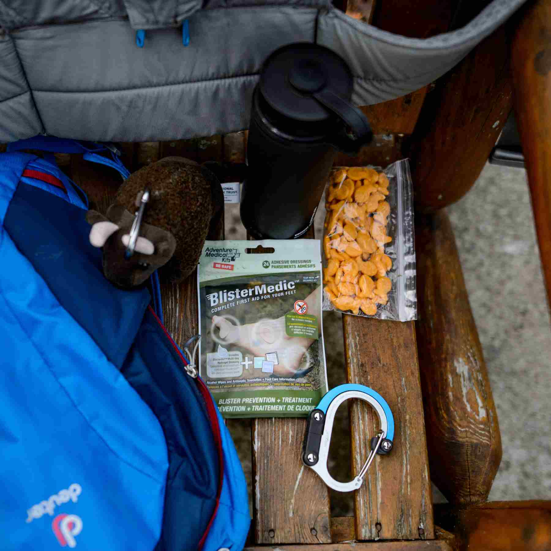 Blister Medic Kit next to bag of snacks and carabiner