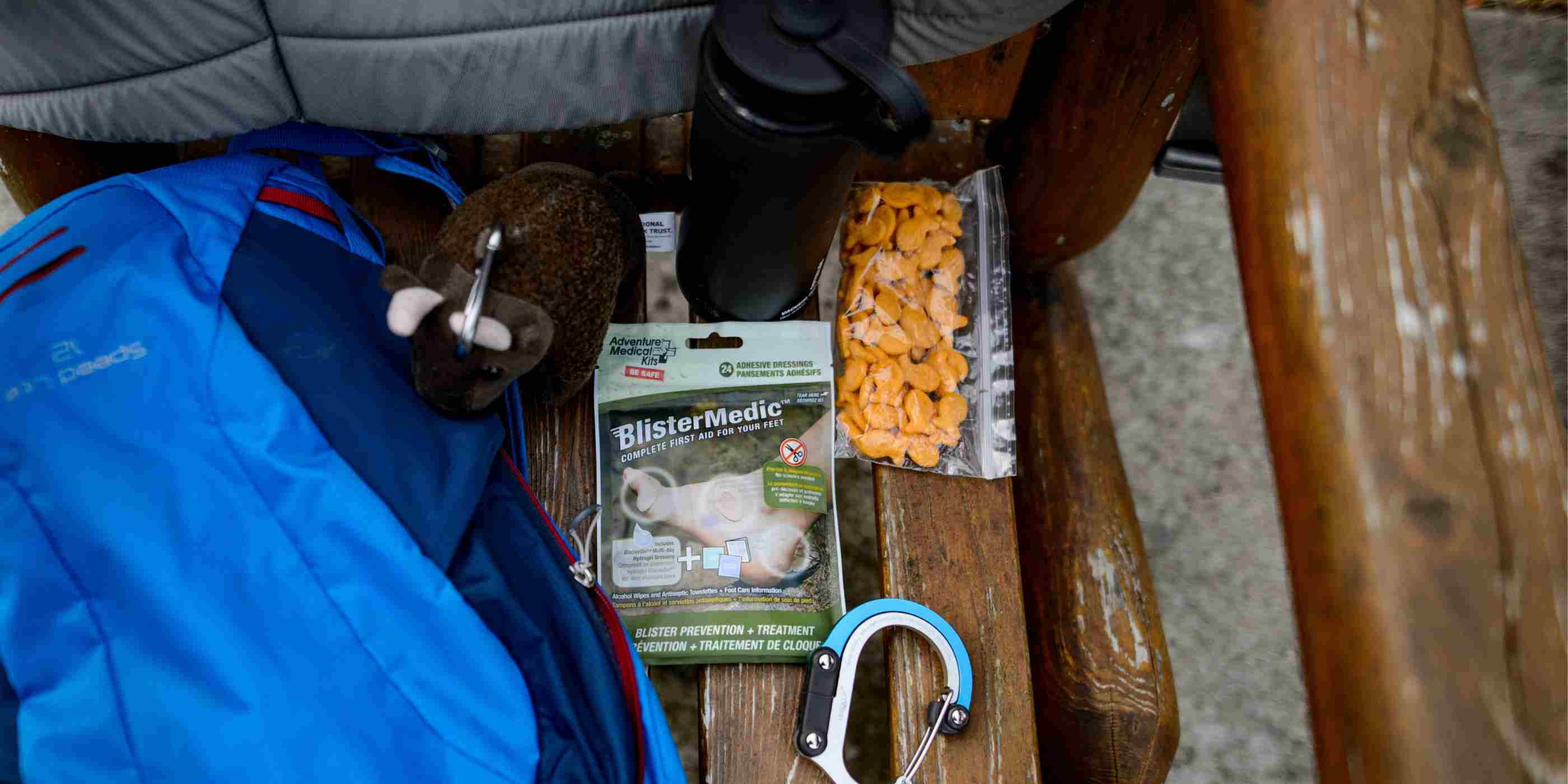 Blister Medic Kit next to bag of snacks and carabiner