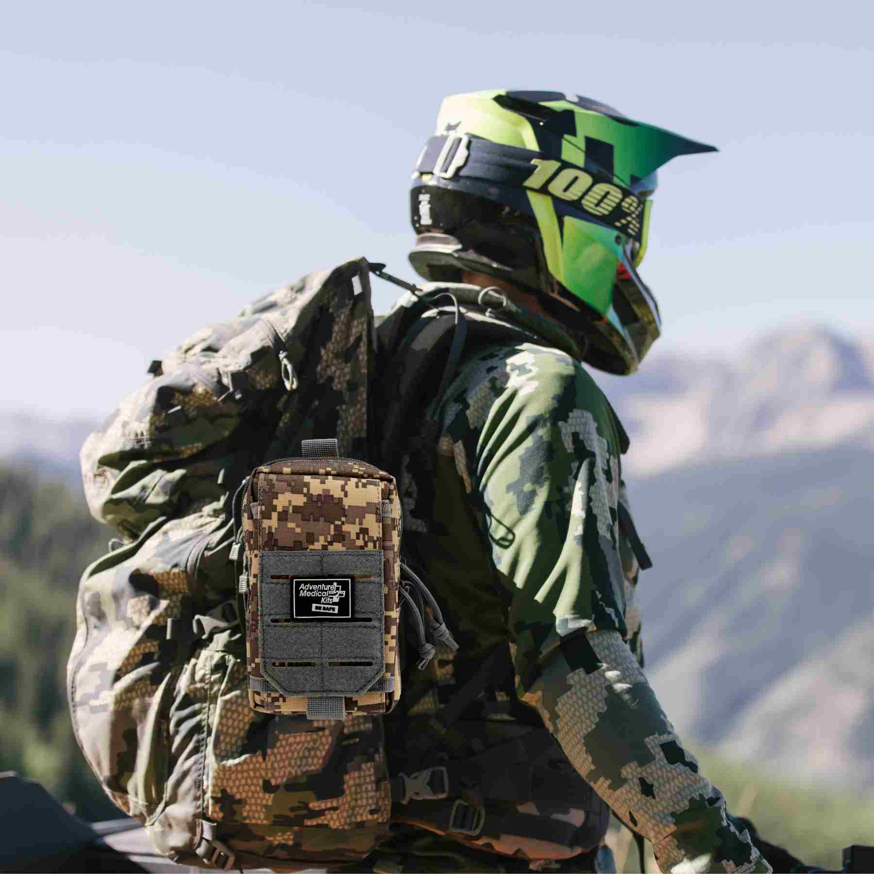 MOLLE Bag Trauma Kit 0.5 - Camo man in helmet wearing kit on backpack