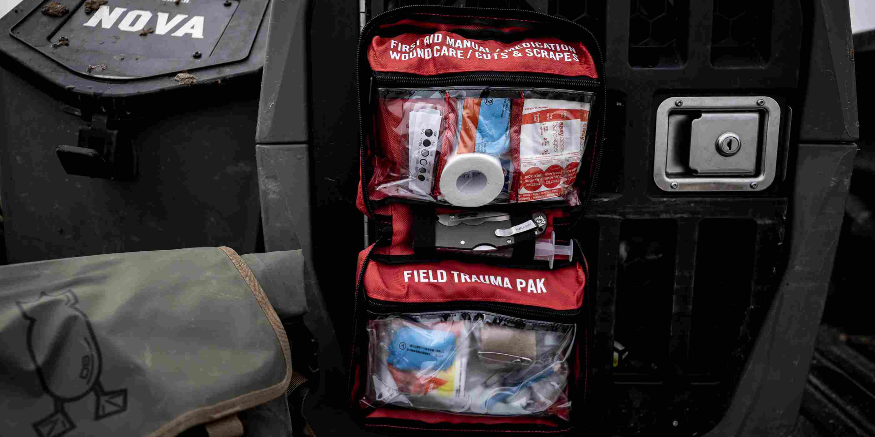 Sportsman Series Medical Kit - 300 kit opened on dog kennel on truck