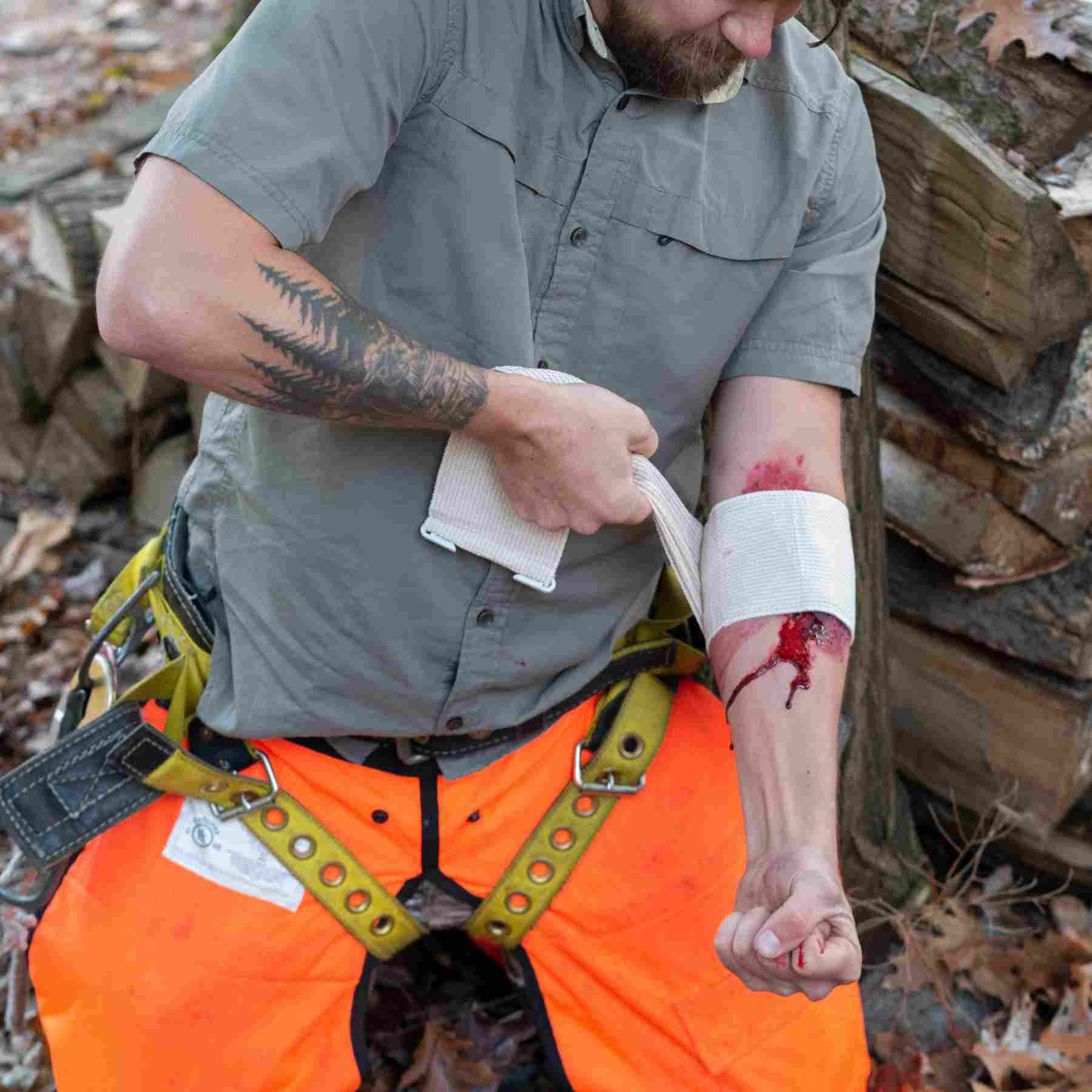 Trauma Pak 1 First Aid Kit for Wound Dressing man using gauze from kit