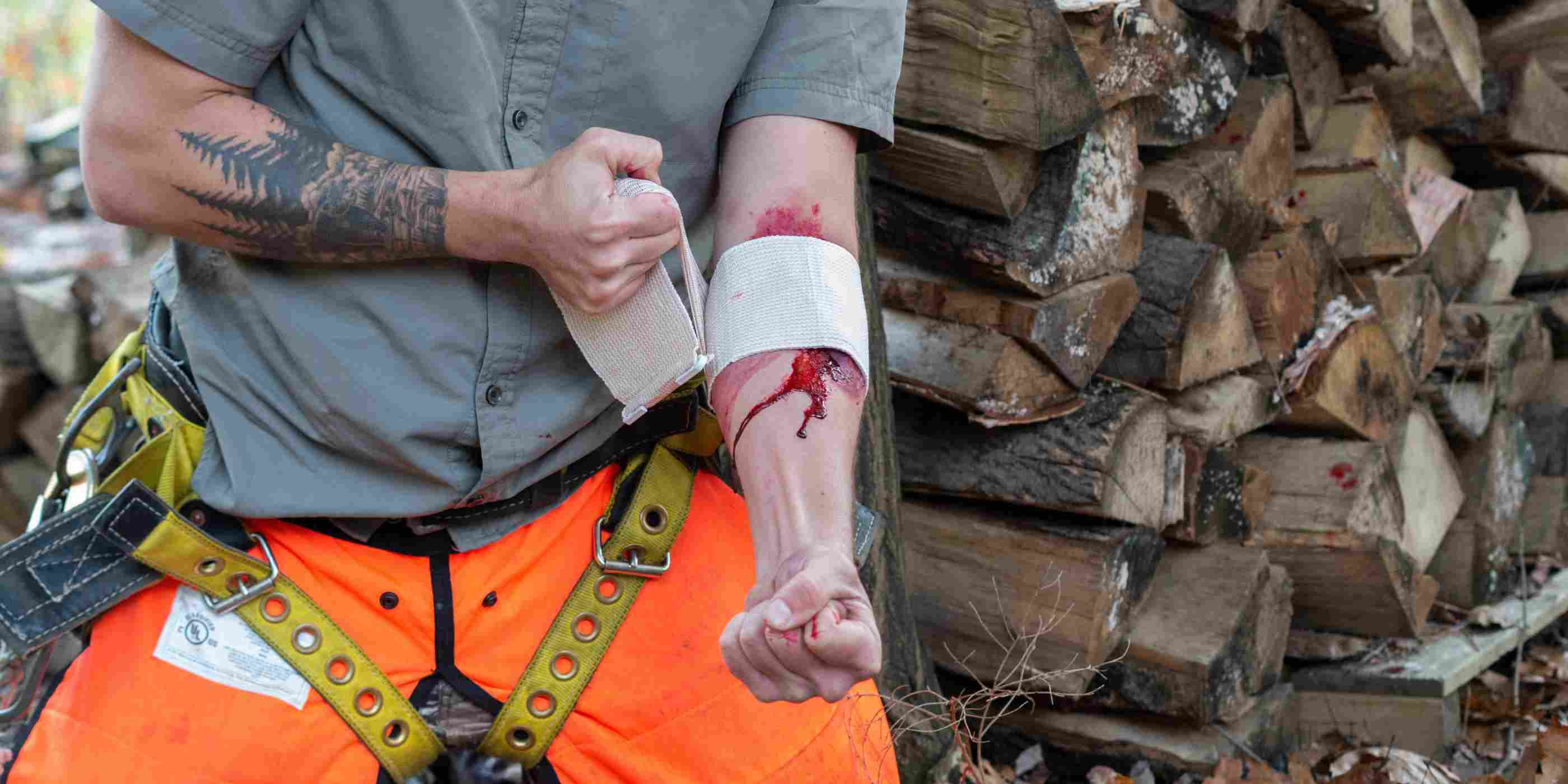 Trauma Pak 1 First Aid Kit for Wound Dressing man using gauze from kit