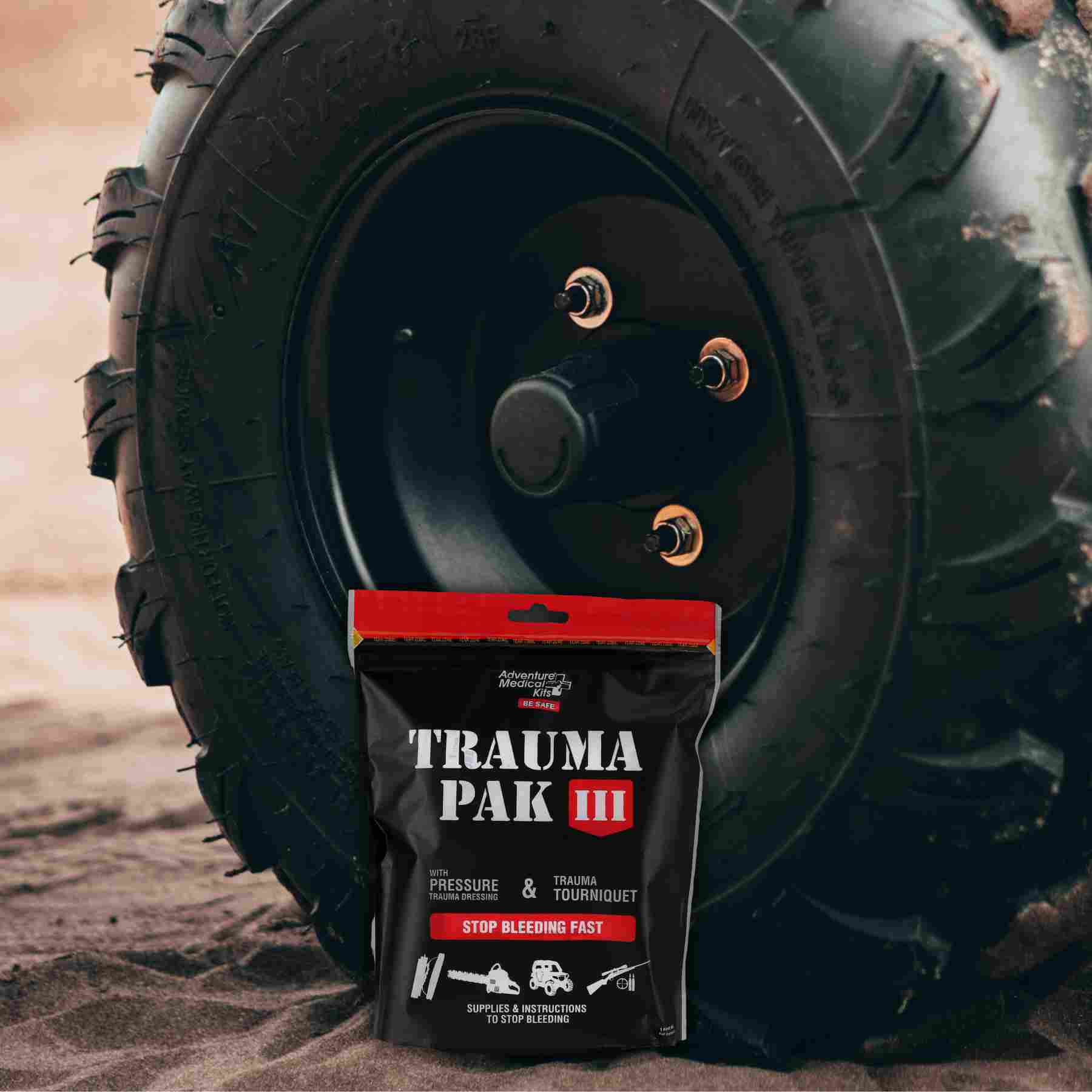Trauma Pak III in front of truck tire