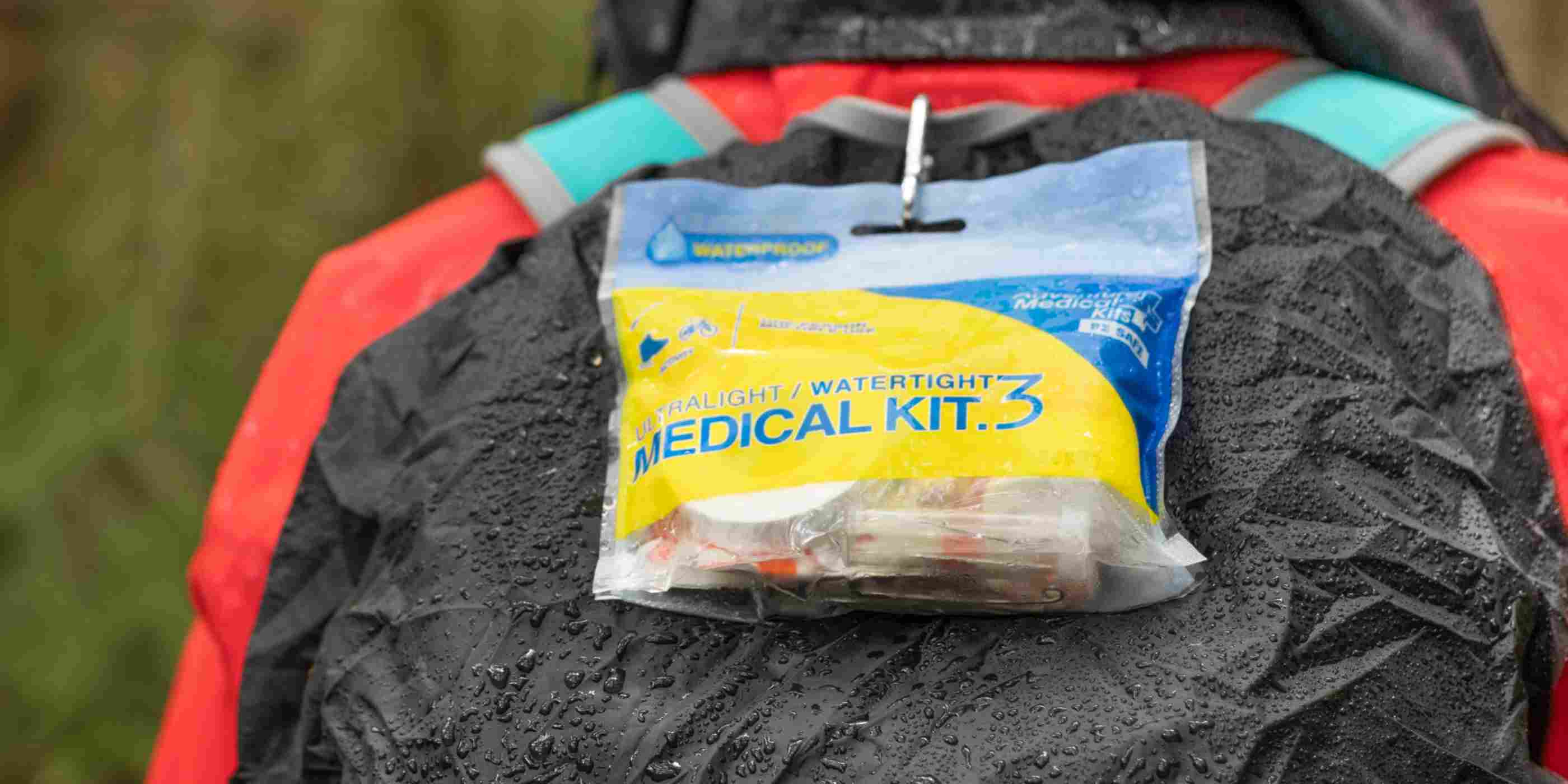 Ultralight/Watertight Medical Kit - .3 wet kit attached to hiker backpack