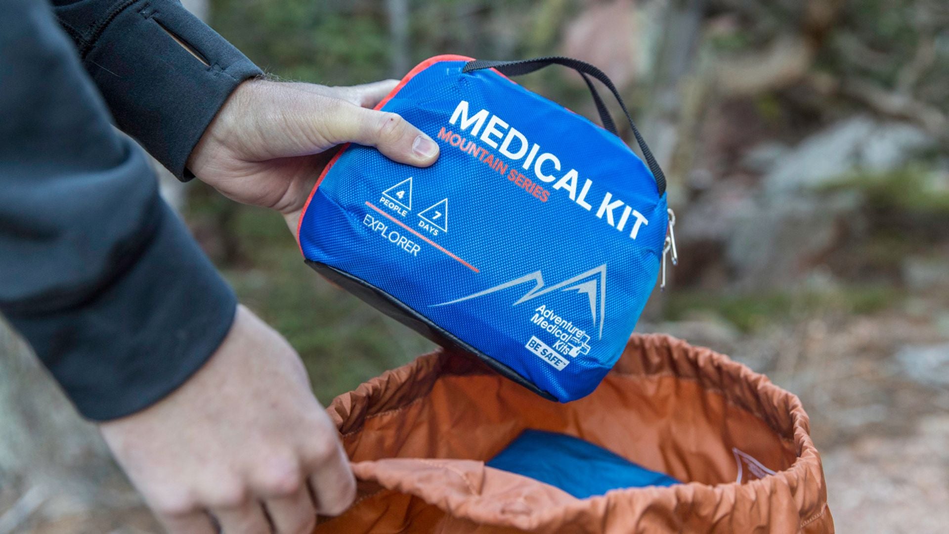 Man's hand holding Explorer Medical Kit