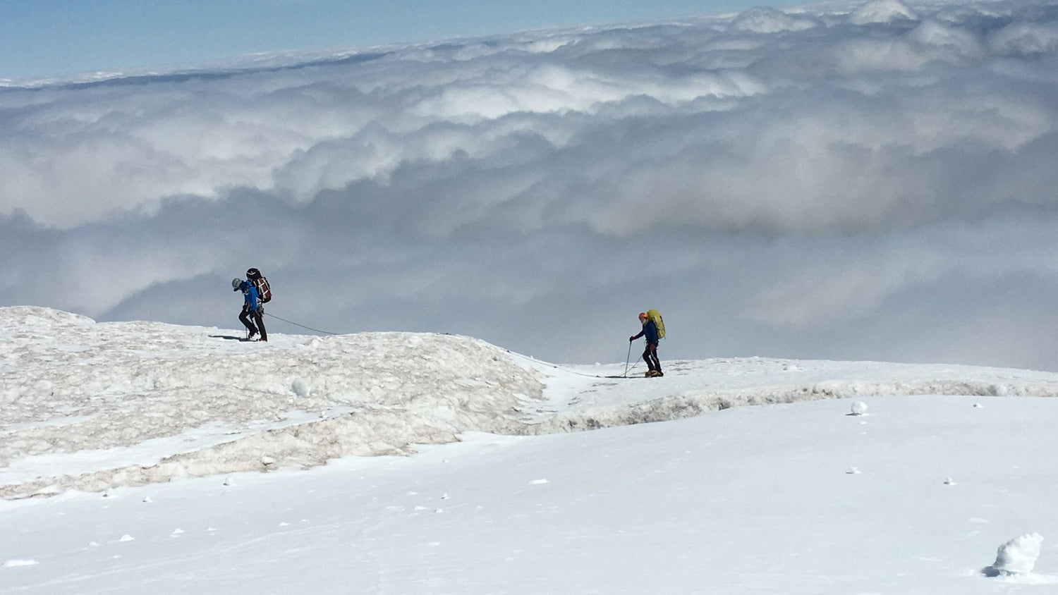 IMG climbers above the clouds on Mt. Rainier