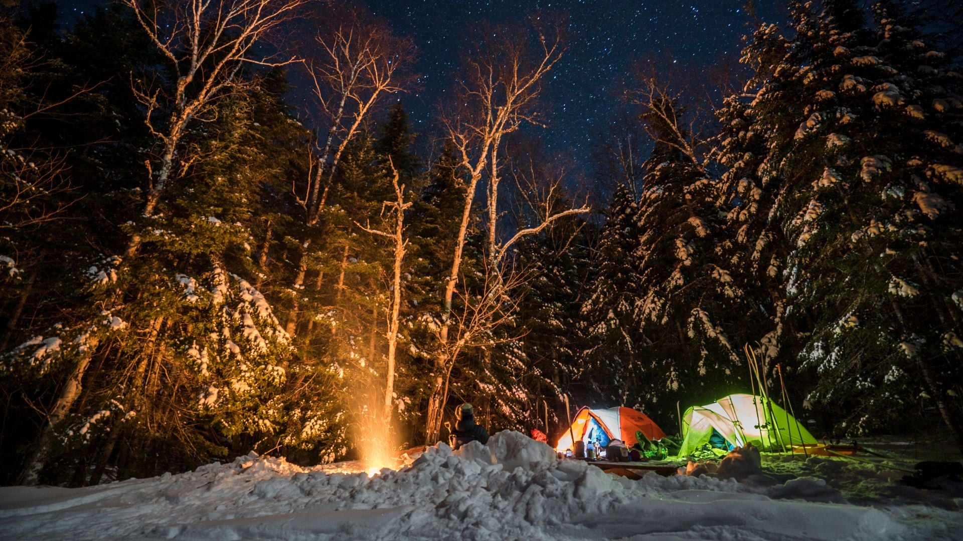 Winter camping with campfire
