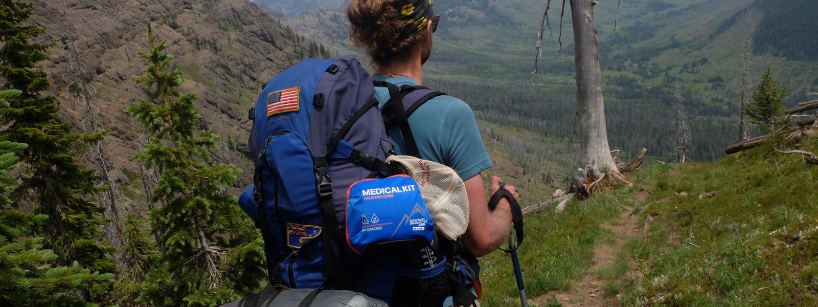 Man with Mountain Series Kit on backpack while hiking