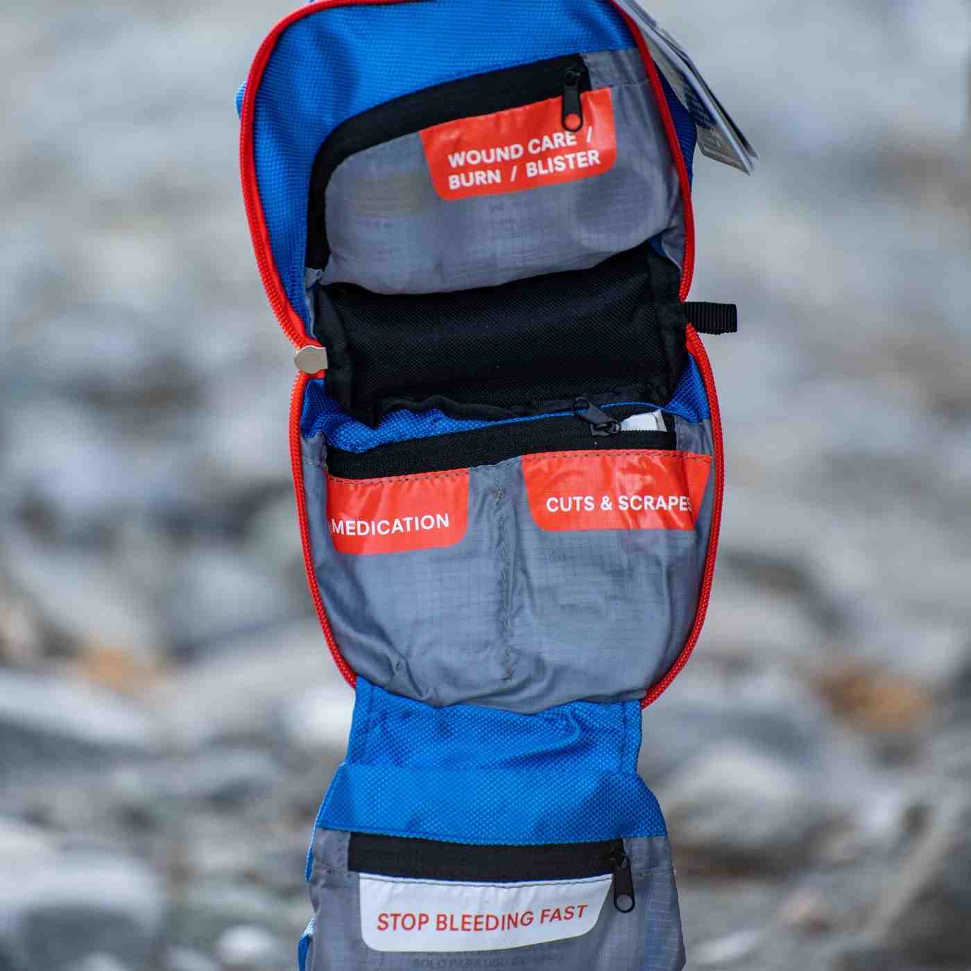 Mountain Series Medical Kit - Hiker opened outside