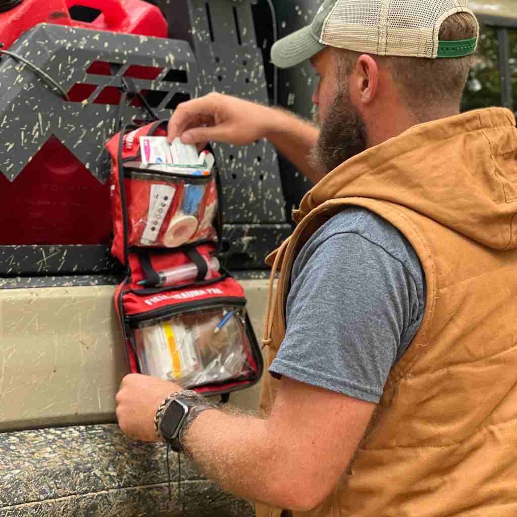 Sportsman Series Medical Kit - 300 man opening hanging kit on muddy truck