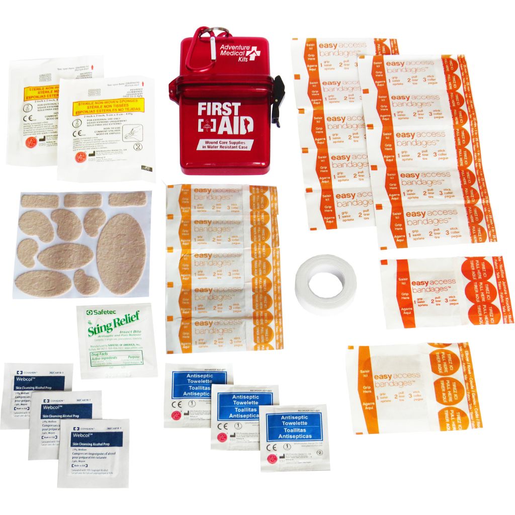 Collection of first aid supplies including bandages and antiseptic wipes on a white background