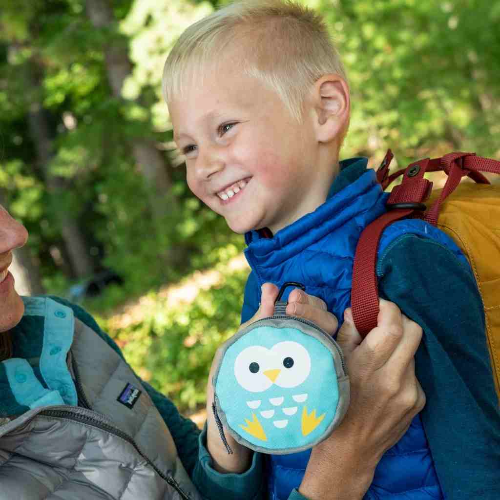 Backyard Adventure Owl First Aid Kit mother attaching kit to child's backpack