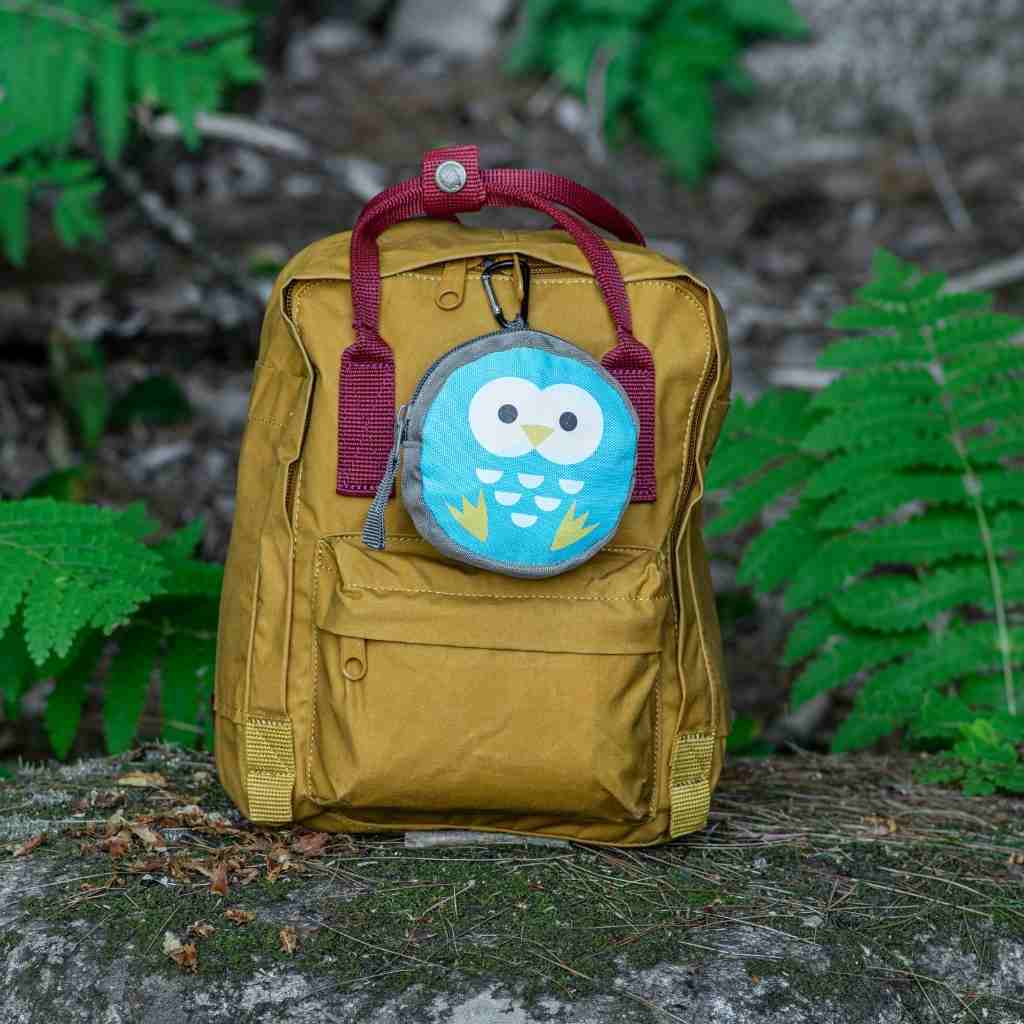 Backyard Adventure Owl First Aid Kit on backpack in woods
