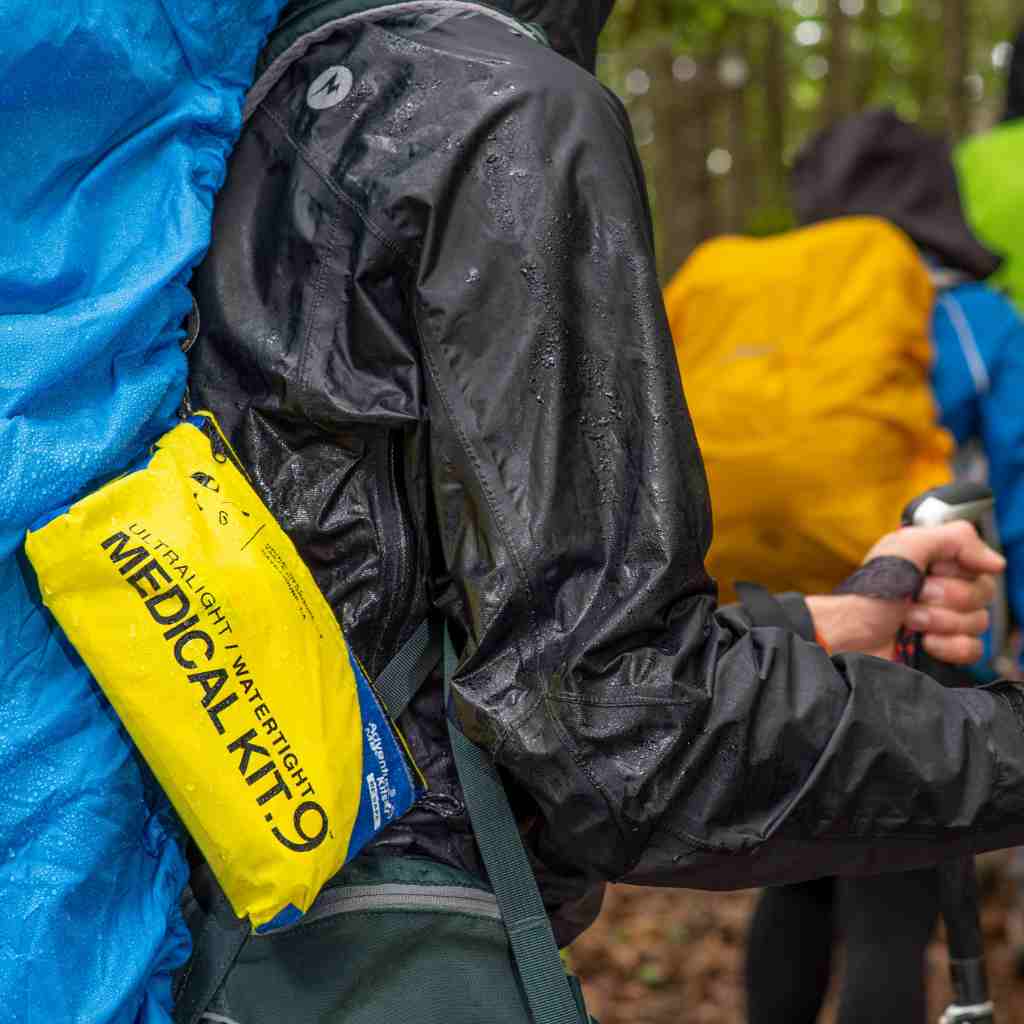 Ultralight/Watertight Medical Kit - .9 kit attached to hiker while raining