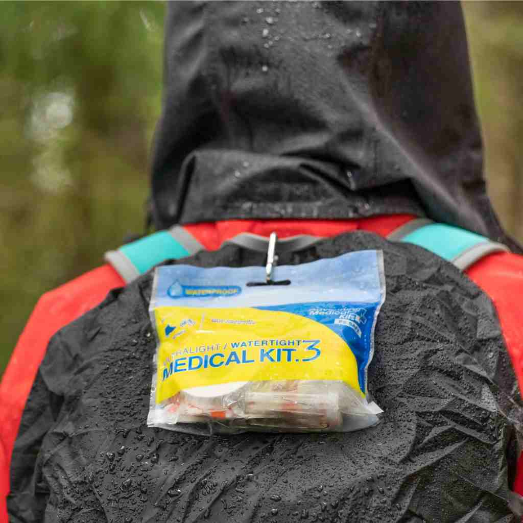 Ultralight/Watertight Medical Kit - .3 wet kit attached to hiker backpack