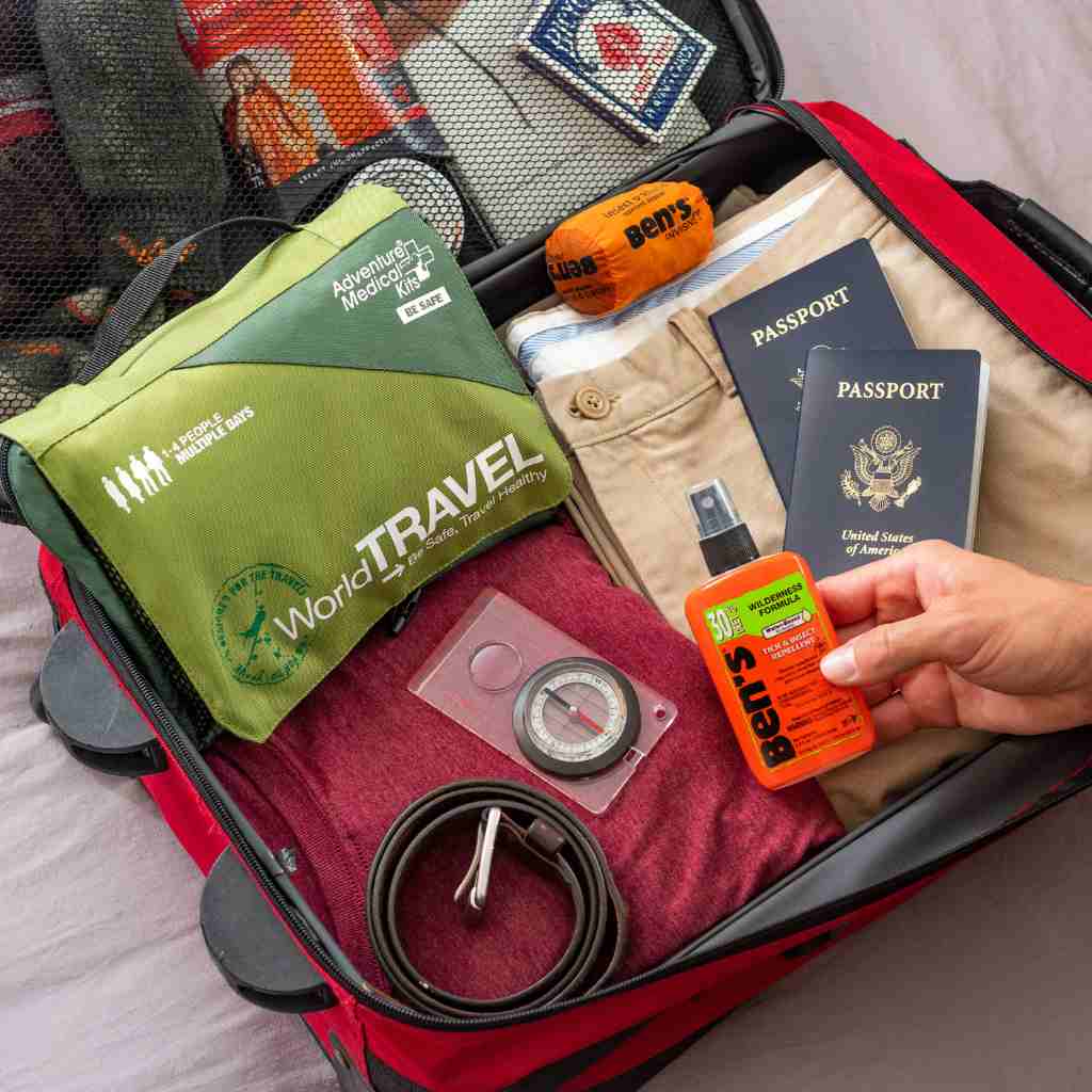 Travel Series Medical Kit - World Travel kit pictured in luggage with passport