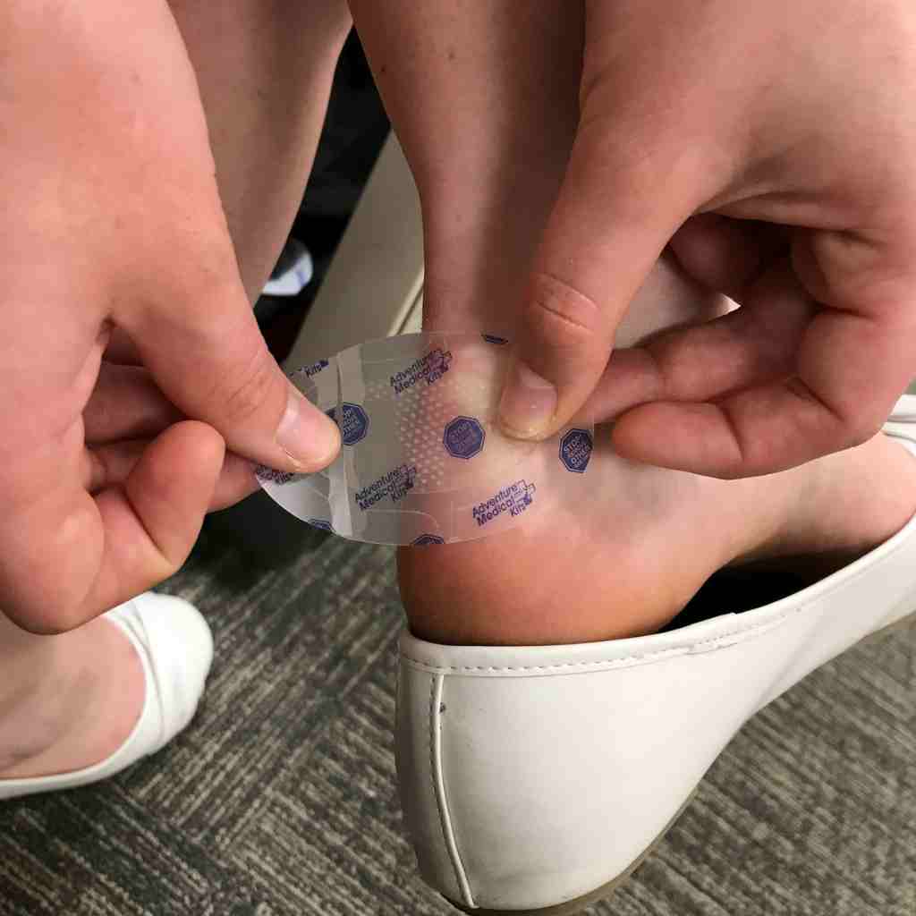GlacierGel Blister and Burn Dressing putting on an ankle in an office