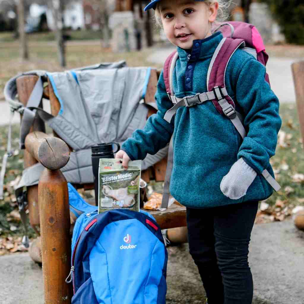 Blister Medic Kit child putting kit in backpack