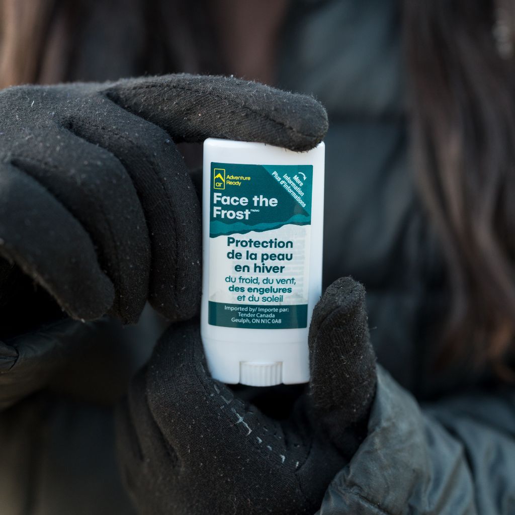 Gloved hands holding Face the Frost