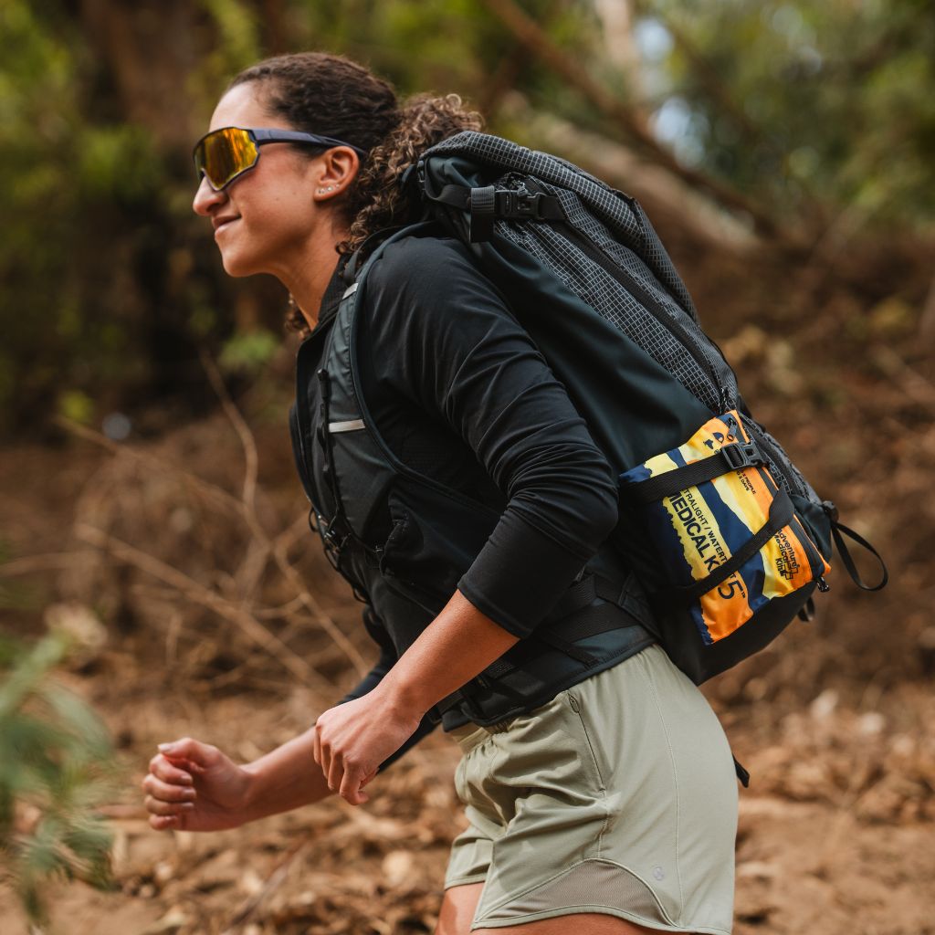 Person hiking with a backpack in a forest