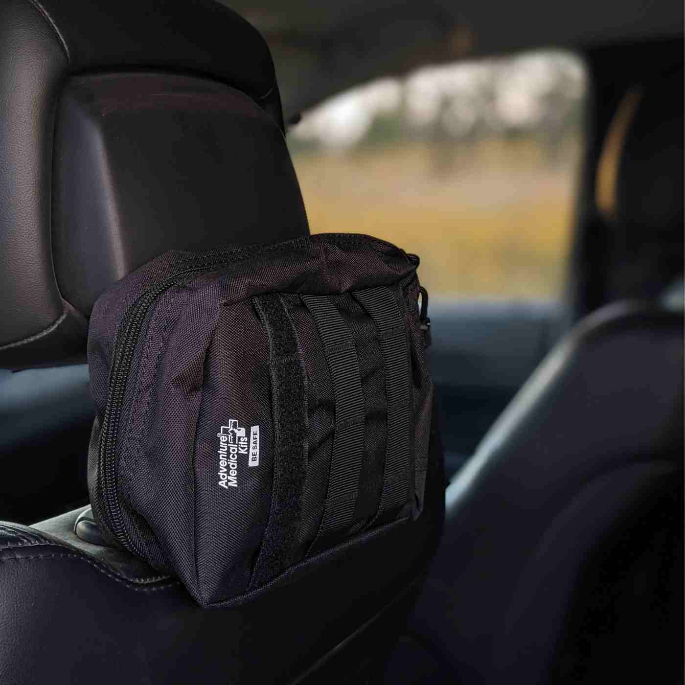MOLLE Bag Trauma Kit 1.0 - Black kit adhered to back of seat headrest
