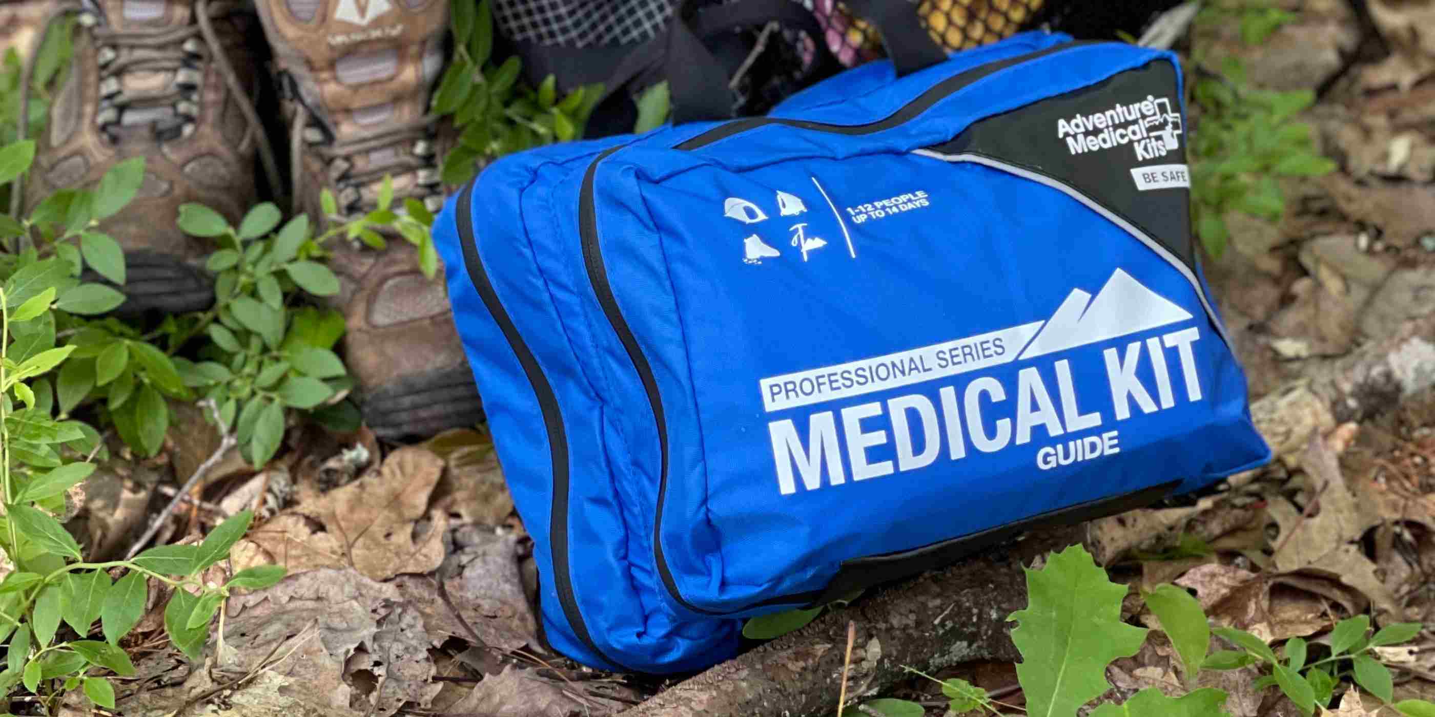 Pro Series Emergency Medical Kit - Guide I kit posed next to hiking gear
