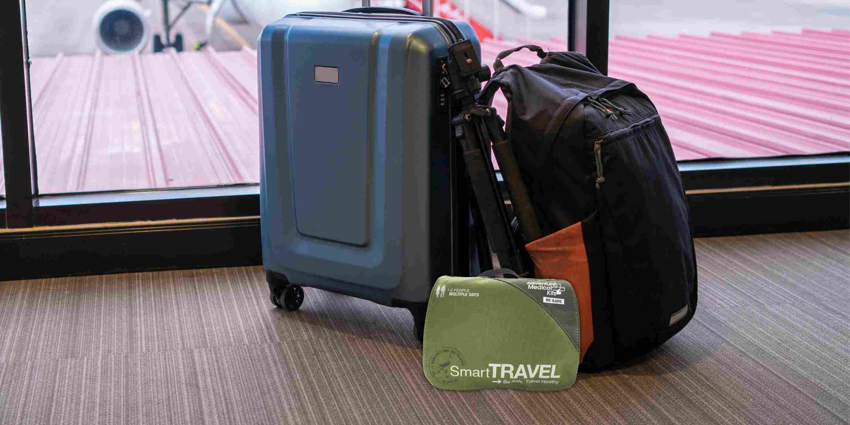 Travel Series Medical Kit - Smart Travel in front of luggage